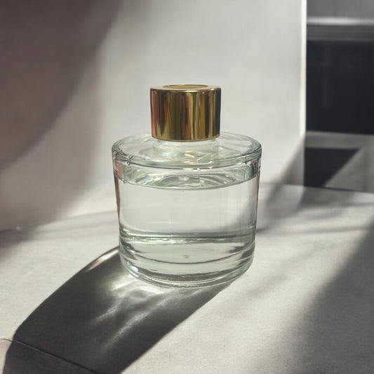 Blank glassbeholder med gulltopp