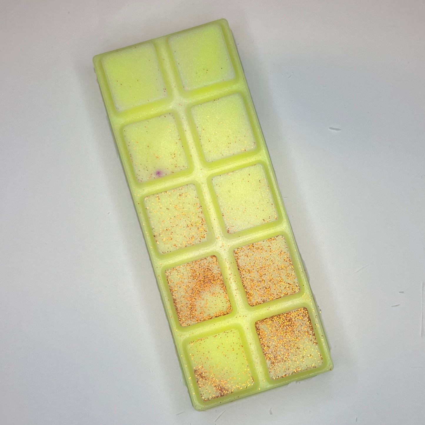 Gul duftvoks/smeltevoks med oransje glitter