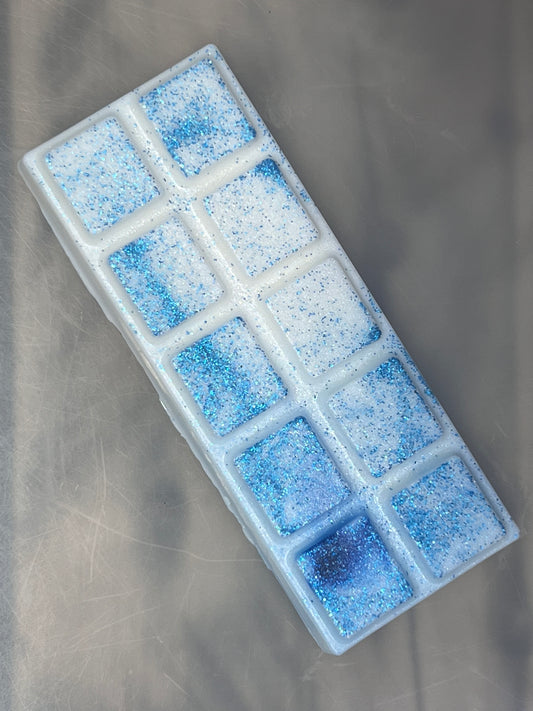 Hvit duftvoks/smeltevoks med blått glitter