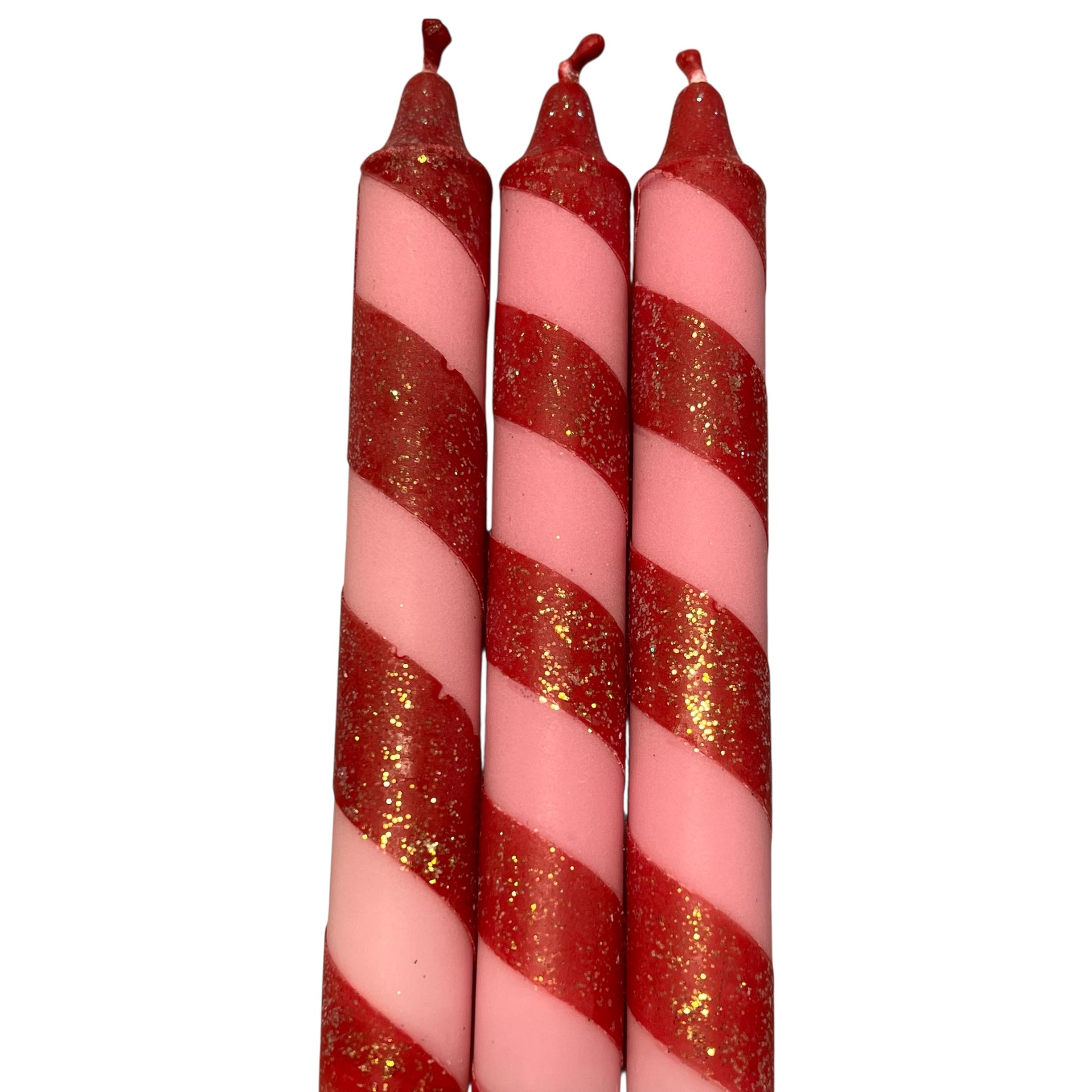 Kronelys i fargene rød og rosa, med glitter