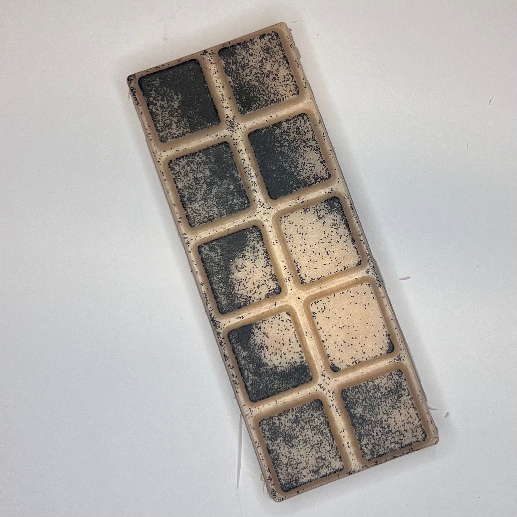 Beige duftvoks/smeltevoks med svart glitter